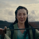Michelle Yeoh as the elven Scian, holding a sword across her palms in The Witcher: Blood Origin